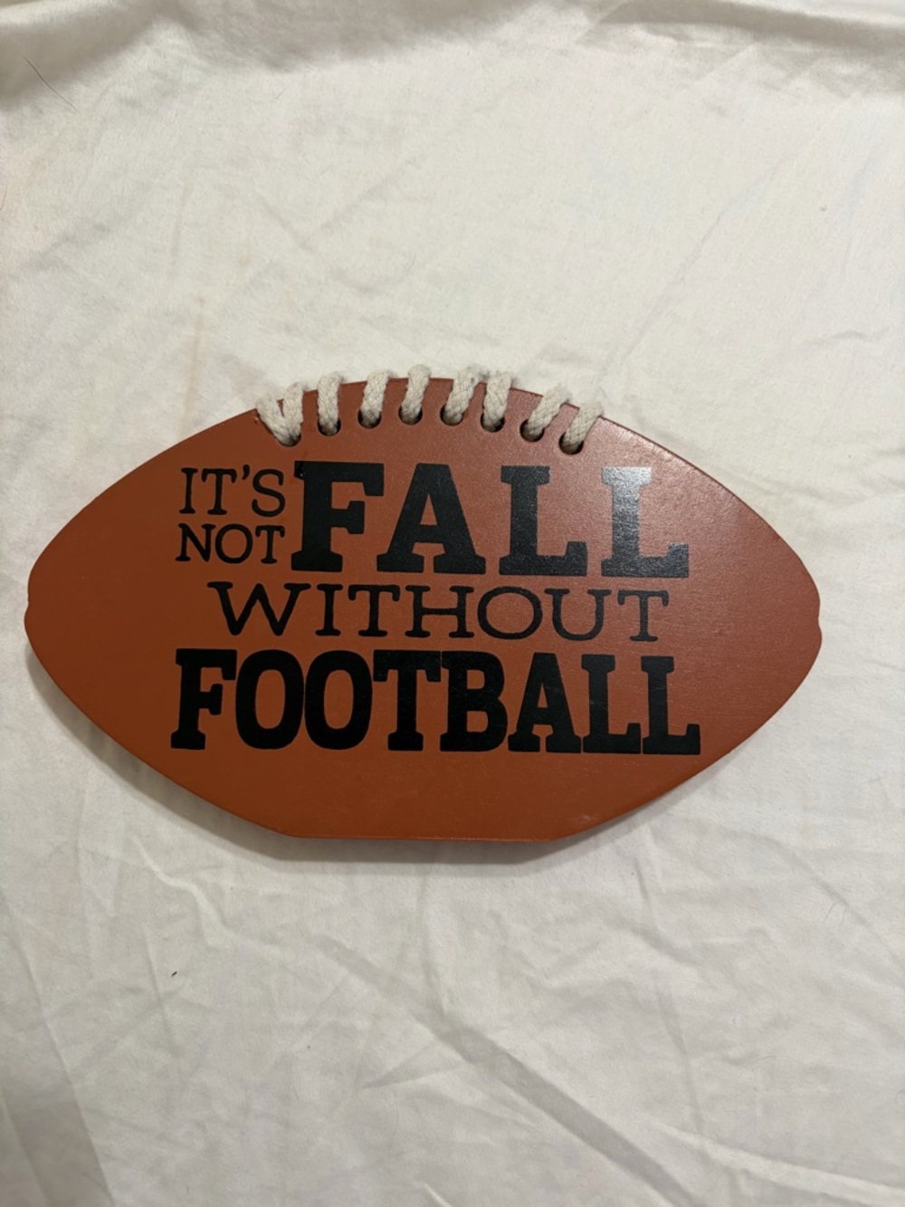 Brown Football-Shaped Sign "It's Not Fall Without Football"